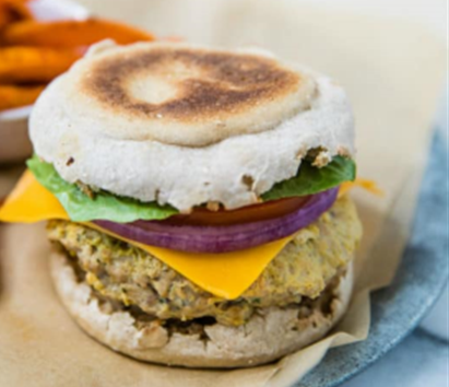 Turkey burger between an English
muffin with cheese, lettuce,
tomato and onion