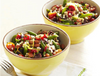 2 bowls of Israeli couscous with green beans, pinto beans, sliced sundried tomato, kalamata olives, and cherry tomato