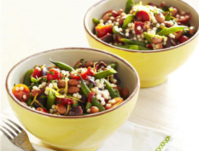 2 bowls of Israeli couscous with green beans, pinto beans, sliced sundried tomato, kalamata olives, and cherry tomato