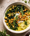 A speckled bowl with stewed herbs, rice, and chick peas 
